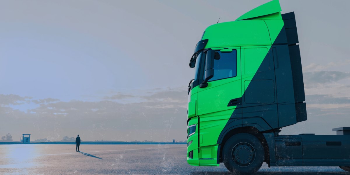 A contemporary aerodynamic HGV tractor unit in a quiet motorway service truck park at first light