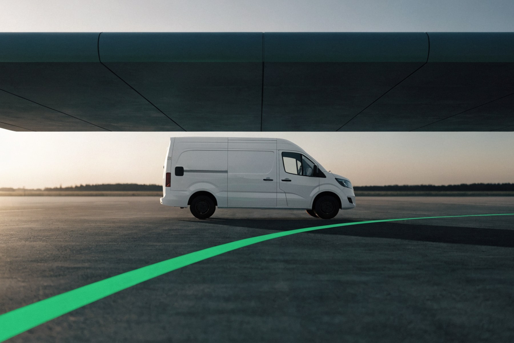 A white panel van at a depot at dawn, one green lane marking sweeping past